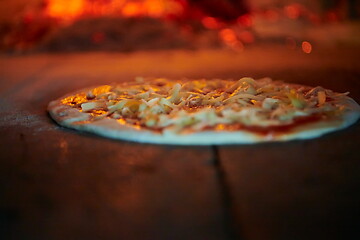 Image showing rustic pizza in wood fired oven