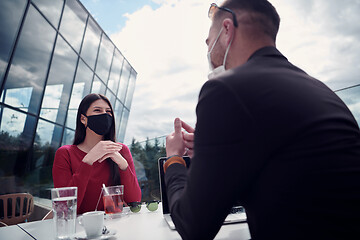 Image showing business people wearing protective mask