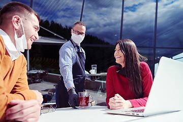 Image showing business people wearing protective mask