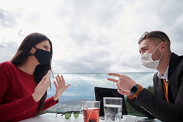 Image showing business people wearing protective mask