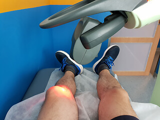 Image showing Physical therapy using a laser to treat an injured knee