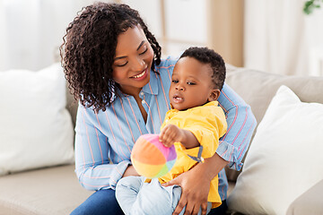 Image showing mother and baby playing with ball at home