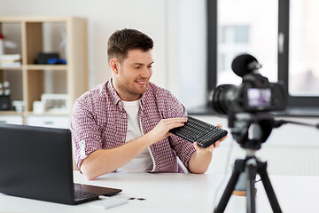 Image showing male video blogger with keyboard videoblogging