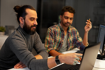 Image showing creative team with computer working late at office