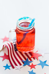 Image showing mug of juice and american flag on independence day