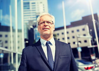 Image showing senior businessman on city street