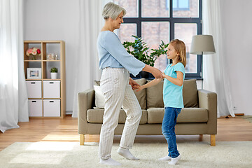 Image showing grandmother and granddaughter having fun at home