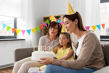 Image showing mother, daughter, grandmother with birthday cake