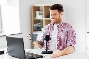 Image showing blogger with laptop and microphone audio blogging