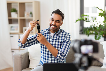 Image showing male blogger with smart watch recording video blog