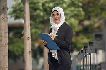 Image showing Beautiful muslim successful businesswoman portrait, confident happy CEO