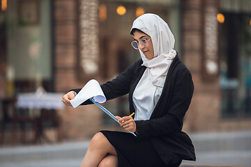 Image showing Beautiful muslim successful businesswoman portrait, confident happy CEO