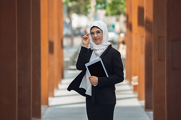 Image showing Beautiful muslim successful businesswoman portrait, confident happy CEO