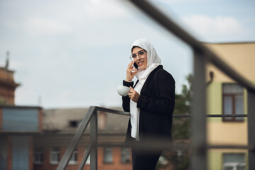 Image showing Beautiful muslim successful businesswoman portrait, confident happy CEO