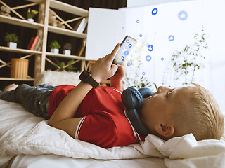 Image showing Boy connecting and sharing social media. Modern UI icons, communication, devices