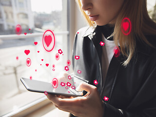 Image showing Girl connecting and sharing social media. Modern UI icons, communication, devices