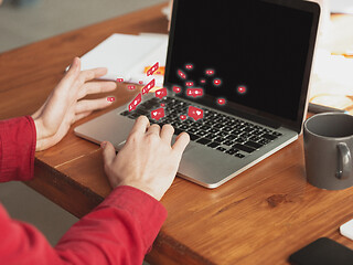 Image showing Close up male hands connecting and sharing social media. Modern UI icons, communication, devices