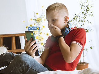 Image showing Boy connecting and sharing social media. Modern UI icons, communication, devices