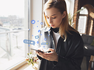 Image showing Girl connecting and sharing social media. Modern UI icons, communication, devices