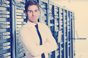 Image showing young it engeneer in datacenter server room