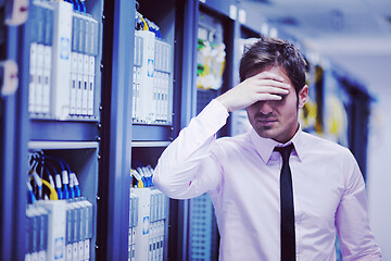 Image showing young it engeneer in datacenter server room