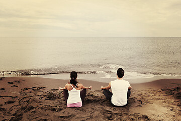 Image showing couple yoga beach