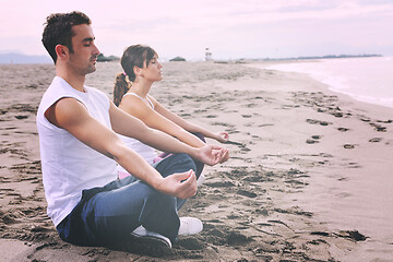 Image showing couple yoga beach