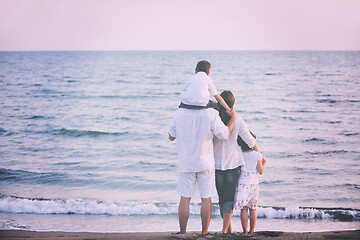 Image showing happy young family have fun on beach