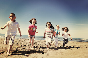 Image showing happy young  people group have fun on beach
