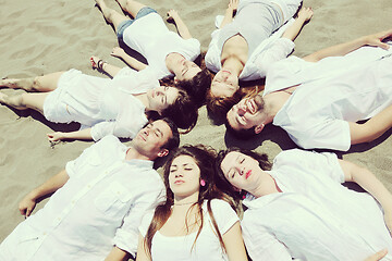 Image showing Group of happy young people in have fun at beach