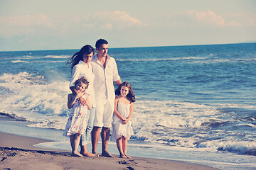 Image showing happy young  family have fun on beach