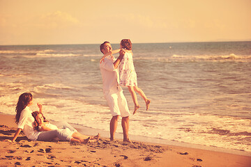 Image showing happy young  family have fun on beach