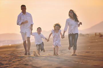 Image showing happy young family have fun on beach