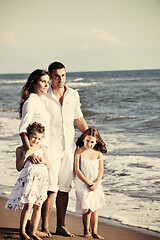 Image showing happy young  family have fun on beach