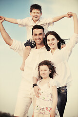 Image showing happy young family have fun on beach