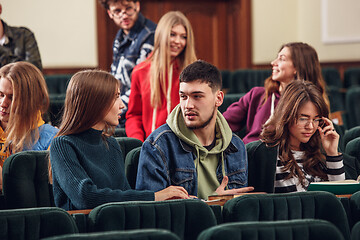 Image showing The group of cheerful happy students sitting in a lecture hall before lesson