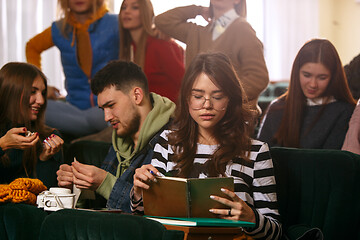 Image showing The group of cheerful happy students sitting in a lecture hall before lesson