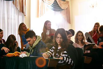 Image showing The group of cheerful happy students sitting in a lecture hall before lesson