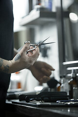 Image showing Tools for cutting beard barbershop top view. Vintage tools of barber shop on wooden background