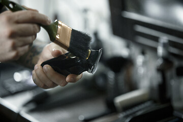 Image showing Tools for cutting beard barbershop top view. Vintage tools of barber shop on wooden background