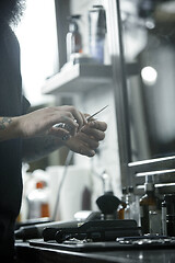 Image showing Tools for cutting beard barbershop top view. Vintage tools of barber shop on wooden background