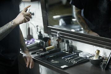 Image showing Tools for cutting beard barbershop top view. Vintage tools of barber shop on wooden background