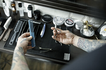 Image showing Tools for cutting beard barbershop top view. Vintage tools of barber shop on wooden background