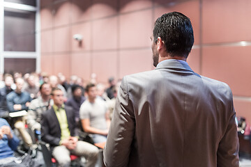 Image showing Public speaker giving talk at business event.