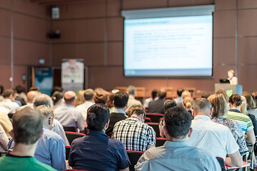 Image showing Woman giving presentation in lecture hall at university.