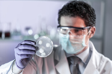 Image showing Scientist working in corona virus vaccine development laboratory research facility.