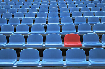 Image showing Empty seats in a stadium with one special