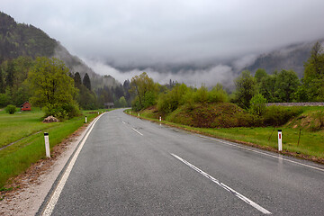 Image showing oad in mountains at morning fog