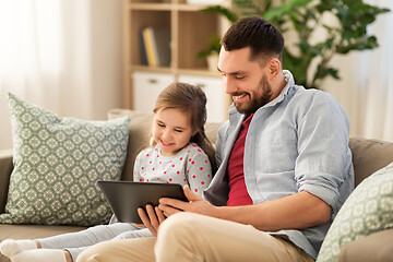 Image showing father and daughter with tablet computer at home