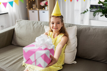 Image showing happy girl with gift box on birthday at home